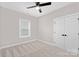 Well-lit bedroom featuring a double door closet and carpet flooring at 1002 Fairground St, Charlotte, NC 28208