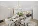 Bright dining room with modern chandelier and view of the kitchen at 1002 Fairground St, Charlotte, NC 28208