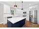 Modern kitchen with a large island, stainless steel appliances, and white cabinets at 1002 Fairground St, Charlotte, NC 28208