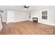 Living room with hardwood floors and a fireplace at 1002 Fairground St, Charlotte, NC 28208