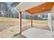 Covered patio with wood ceiling and concrete flooring at 1002 Fairground St, Charlotte, NC 28208