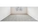 Empty bedroom with grey carpet and two windows at 105 Ciara Pl # B, Mooresville, NC 28117