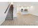 Modern kitchen island with white cabinets and granite countertops at 105 Ciara Pl # B, Mooresville, NC 28117