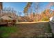 Backyard with deck, trampoline, and wooded area at 160 Hedgewood Dr, Mooresville, NC 28115