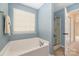 Relaxing bathroom with soaking tub and shower at 160 Hedgewood Dr, Mooresville, NC 28115