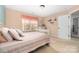 Bedroom with striped bedding and built-in shelving at 160 Hedgewood Dr, Mooresville, NC 28115