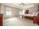 Well-lit bedroom with ceiling fan and ample space at 160 Hedgewood Dr, Mooresville, NC 28115