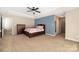 Spacious bedroom with a ceiling fan and large windows at 160 Hedgewood Dr, Mooresville, NC 28115