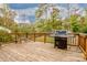 Deck with built-in gas grill and seating area at 160 Hedgewood Dr, Mooresville, NC 28115