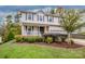 Two-story house with light pink siding, landscaping, and a two-car garage at 160 Hedgewood Dr, Mooresville, NC 28115