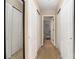 Long hallway with mirrored closet doors and carpet at 160 Hedgewood Dr, Mooresville, NC 28115