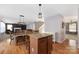 Open kitchen with island and view of living area at 160 Hedgewood Dr, Mooresville, NC 28115