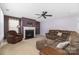 Living room with fireplace and brown sectional at 160 Hedgewood Dr, Mooresville, NC 28115