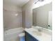 Bathroom features modern vanity with quartz countertop and bath tub at 1865 Rock Hill Church Rd # 3, Matthews, NC 28104