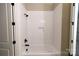 Modern bathroom with a tiled bathtub, shower, black shower head and faucet at 1865 Rock Hill Church Rd # 3, Matthews, NC 28104