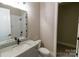 Bathroom features a white marble vanity, sink, toilet, and a subway tiled shower/bath combo at 1865 Rock Hill Church Rd # 3, Matthews, NC 28104