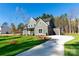 Beautiful two-story home with a well-maintained lawn and a private driveway leading to a garage at 1865 Rock Hill Church Rd # 3, Matthews, NC 28104