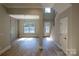 Inviting living area with an open layout, showcasing seamless flow to the dining area and staircase at 1865 Rock Hill Church Rd # 3, Matthews, NC 28104