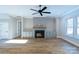 Inviting living room with a cozy fireplace, built-in cabinets, and large windows for natural light at 1865 Rock Hill Church Rd # 3, Matthews, NC 28104