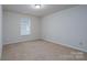 Simple bedroom with neutral walls and carpeted floors at 4126 Kellybrook Dr, Concord, NC 28025