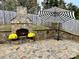 Stone fireplace in backyard patio area at 4126 Kellybrook Dr, Concord, NC 28025