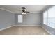 Bright living room with tile floors and ceiling fan at 4126 Kellybrook Dr, Concord, NC 28025