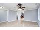 Open living area with tile floors and access to staircase at 4126 Kellybrook Dr, Concord, NC 28025