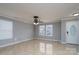 Spacious living room featuring tile floors and multiple windows at 4126 Kellybrook Dr, Concord, NC 28025