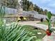 Stone patio with a fireplace and lush greenery at 4126 Kellybrook Dr, Concord, NC 28025