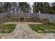 Stone patio with a fireplace and umbrella at 4126 Kellybrook Dr, Concord, NC 28025