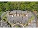 Aerial view of townhomes showing rooftops, patios, and well-maintained landscaping in a planned community at 8336 Indigo Row, Charlotte, NC 28277