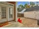 Paver patio with red brick accents provides a cozy outdoor retreat for relaxation and entertaining at 8336 Indigo Row, Charlotte, NC 28277