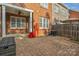 Brick patio with an overhead ceiling fan, perfect for outdoor entertaining or relaxation at 8336 Indigo Row, Charlotte, NC 28277