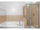 Bathroom with a tub and shower at 8336 Indigo Row, Charlotte, NC 28277