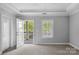 Bedroom with view to an outdoor porch at 8336 Indigo Row, Charlotte, NC 28277