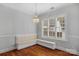 Bright dining area with a built-in bench seat, hardwood floors, and natural light at 8336 Indigo Row, Charlotte, NC 28277