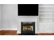 Close up on the fireplace and built-in shelving in the living room at 8336 Indigo Row, Charlotte, NC 28277