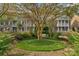 Well-manicured front yard with walking path, green space and mature trees at 8336 Indigo Row, Charlotte, NC 28277