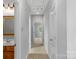 Hallway view showing access to bedrooms and bathroom with neutral color palette at 8336 Indigo Row, Charlotte, NC 28277