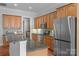 Modern kitchen showcasing granite countertops, stainless steel appliances, and wood cabinets at 8336 Indigo Row, Charlotte, NC 28277