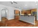 Open kitchen area featuring wood cabinets, stainless steel appliances, and granite countertops at 8336 Indigo Row, Charlotte, NC 28277