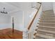 Staircase with carpet steps and hardwood floors at 8336 Indigo Row, Charlotte, NC 28277