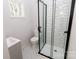 Modern bathroom with a walk-in shower and white subway tile at 8724 Old Plank Rd, Charlotte, NC 28216