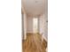 Light and bright hallway with hardwood floors and access to multiple rooms at 8724 Old Plank Rd, Charlotte, NC 28216