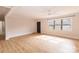 Bright living room with hardwood floors and exterior view at 8724 Old Plank Rd, Charlotte, NC 28216