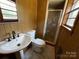 Bathroom with pedestal sink, toilet and shower at 925 Rock Grove Church Rd, Salisbury, NC 28146