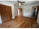 Hardwood floor bedroom with double door closet and ceiling fan at 925 Rock Grove Church Rd, Salisbury, NC 28146