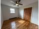 Bright bedroom with wood flooring and double door closet at 925 Rock Grove Church Rd, Salisbury, NC 28146