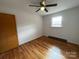 Spacious bedroom with hardwood floors and ceiling fan at 925 Rock Grove Church Rd, Salisbury, NC 28146