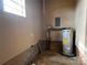 Laundry area with water heater and ample space at 925 Rock Grove Church Rd, Salisbury, NC 28146